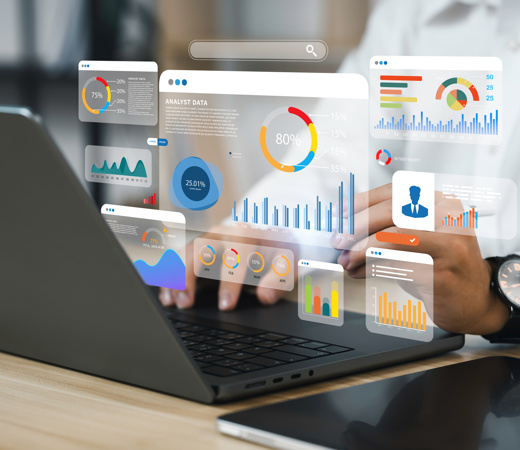 A man focused on UI data tasks at his computer.